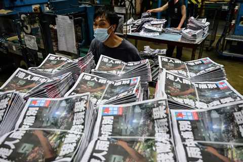 Hong Kong police arrest top writer from shuttered Apple Daily