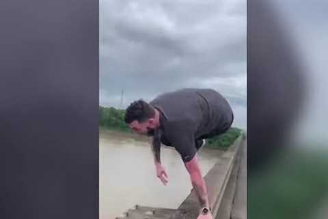 Driver ‘bored in traffic’ jumped 100ft into river – then was arrested after being rescued
