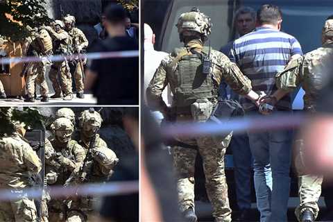Man storms into Ukrainian government building and threatens to detonate grenade