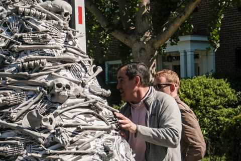 Activists bring vaccine demands and a mountain full of fake bones to Biden's home, where they are..