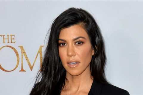 Kourtney Kardashian Shows Off Her Engagement Ring in a Sultry, Shirtless Bedroom Photo