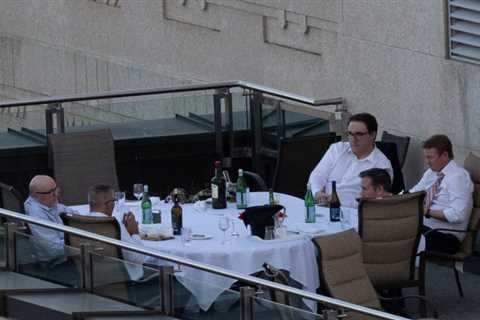 Jason Kenney and his ministers, along with a few bottles red wine