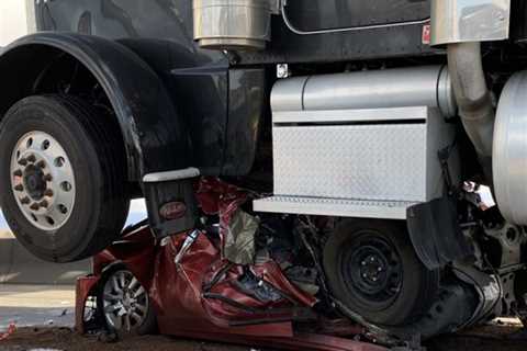 Woman Somehow Walks Away From Nissan Folded in Half and Completely Flattened by Semi Truck