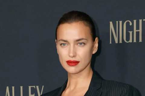 Irina Shayk Looks Great in Barely There Top, While Helping Bradley Cooper at Event