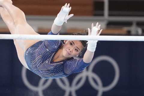 Nina Derwael grabs gold in the uneven bars, as Sunisa Lee falls.