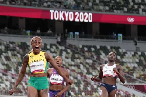 Elaine Thompson-Herah from Jamaica wins the 100-meter dash.