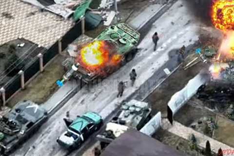 Ukraine drones drop bombs above target Russian troops in armored vehicles in Kherson