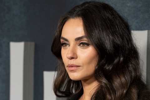 Mila Kunis Stuns In Thigh-High Boots And This Season’s Biggest Fashion Trend