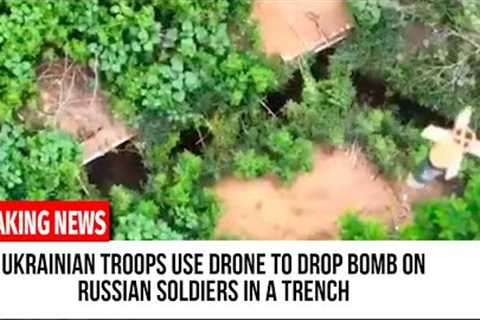 Ukrainian troops use drone to drop bomb on Russian soldiers in a trench