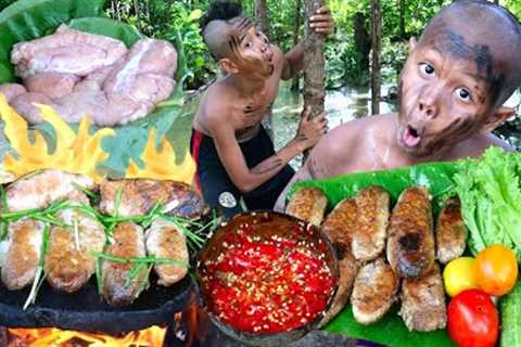 Survival skills. Cooking fish egg on a rock in the rainforest