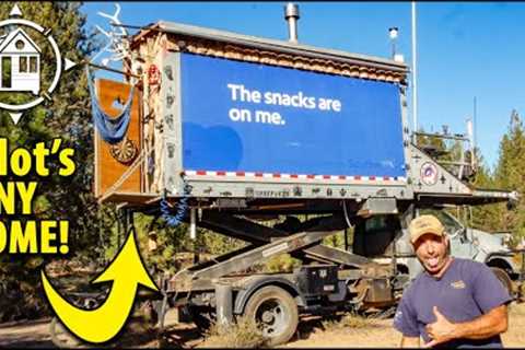 Pilot lives in airline box truck conversion w/ scissor lift