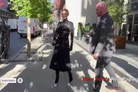 Emily Blunt signs autographs while leaving her hotel.