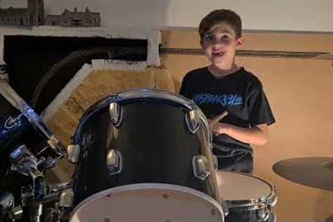 Learning to play the drums. First time playing along to music, We Will Rock You by Queen.