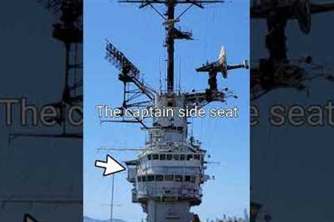 Where is the captain's cabin, chair, and seat located on an aircraft Carrier?