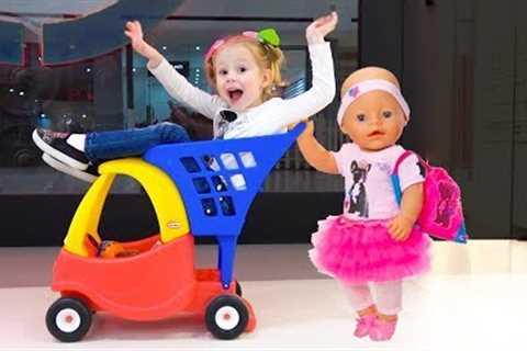 Stacy is having fun shopping with the baby doll