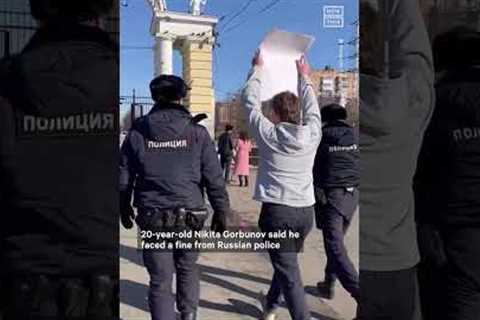 Russian Man Fined For ‘Hug If You’re Against the War’ Sign