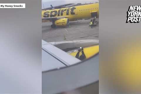 Worker taping Spirit Airlines plane wing goes viral as social media baffled | New York Post