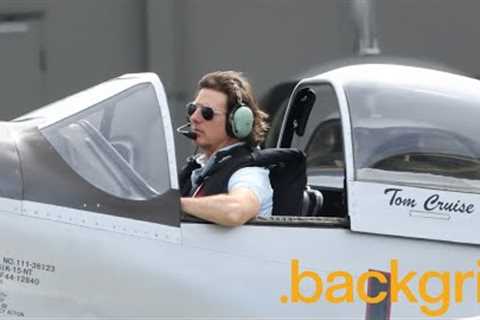 Tom Cruise gives a thumbs-up as he sits in his private plane with the cockpit open