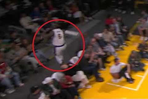 LeBron James hurdles front row fans after hustling for a loose ball | NBA on ESPN