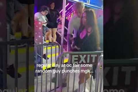 Megan Fox gets slammed into barricade as man tries to punch Machine Gun Kelly at fair #shorts