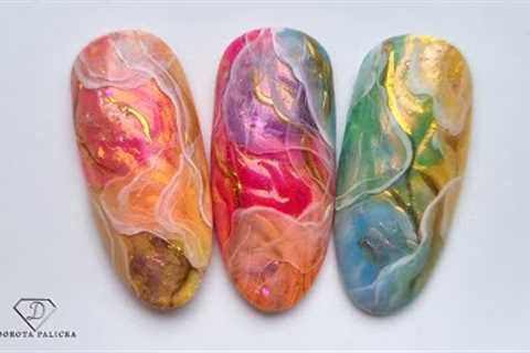 Inlay nail art with chrome pigments. Encapsulated layered nail design