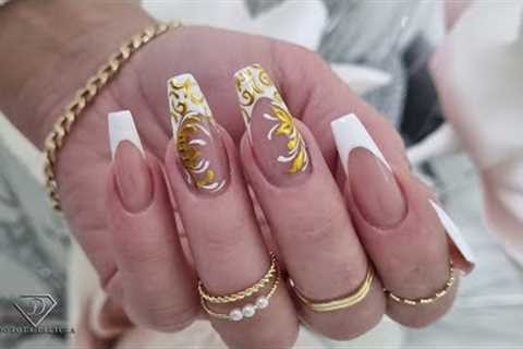 White and gold embossed nail art. Filigree nail art design. Fremch manicure