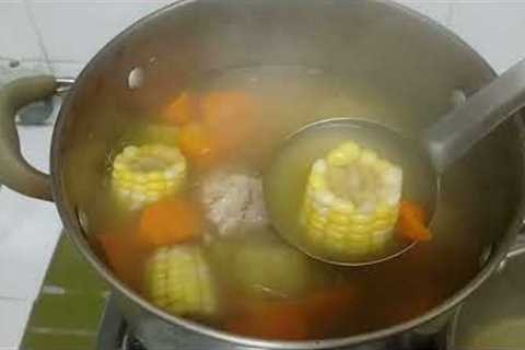 simple dinner for 2, corn, carrot soup, stirfry spinach in shrimp paste, garlic prawns