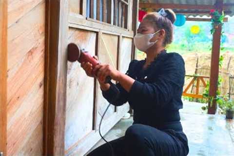 Grinding wooden house columns and walls to prepare for house painting -Living alone on a remote farm