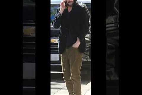 Keanu Reeves 59 rocks a casual look and shaggy beard as he goes Black Friday shopping at Louis