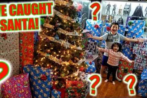 WE CAUGHT SANTA BRINGING THE BEST CHRISTMAS PRESENTS! ARI AND ETHANS FAVORITE MYSTERY SUPRISE GIFTS!