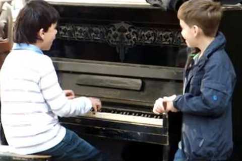 Piano prodigy kid performing on Session street in Lviv