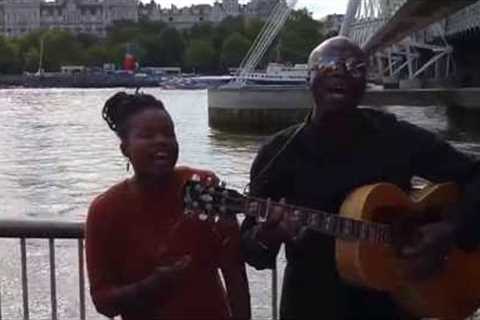 Watch Seal sing Kiss From A Rose in a London street with busker Sherika, 2016
