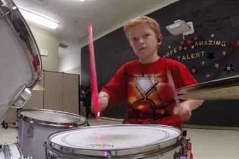 Iron Man 10 year old drumming. Starts at 3:35