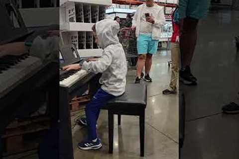 Child prodigy sits down at Costco.