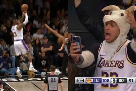LeBron James hits insane 3 falling out of bounds and has Nets fans cheering 😱