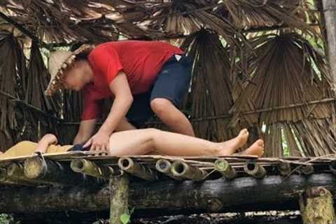 Wild survival girl makes shelter and fishes.