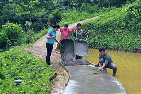 The villagers came to help DAU &amp; TU complete the entire solid road. Coping with stormy season