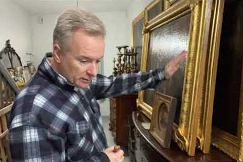 The ochre sides of antique gilt picture frames