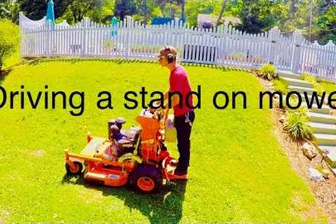 How to operate a stand on mower.