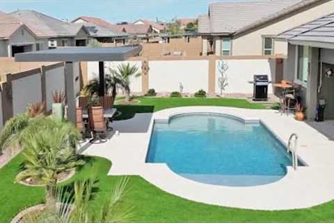 Artificial Turf and Pavers Installed around swimming Pool