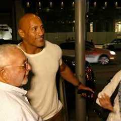 THE ROCK DWAYNE JOHNSON GREETS FANS OUTSIDE OF A RESTAURANT IN BEVERLY HILLS CALIFORNIA