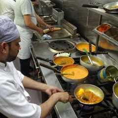 The Heat of the Curry Master's Kitchen on a Busy Friday Night at Shambhala Village Indian Restaurant