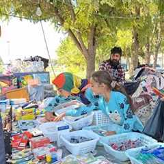 School and dreams: buying school supplies for two sisters' study trip