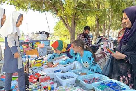 School and dreams: buying school supplies for two sisters' study trip
