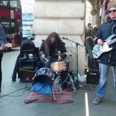 U2, With Or Without You cover - busking in the streets of London, UK