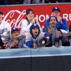 Fan interferes at World Series and reaches for ball at the wall in Yankees vs. Dodgers