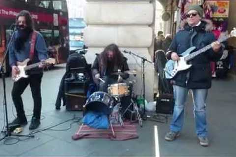 U2, With Or Without You cover - busking in the streets of London, UK