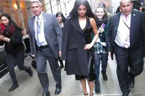 Selena Gomez leaves office building and walk to studio in rainy New York