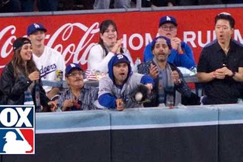 Fan interferes at World Series and reaches for ball at the wall in Yankees vs. Dodgers
