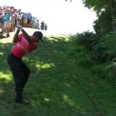 Tiger Woods’ spectacular recovery shot on No. 12 at Quicken Loans